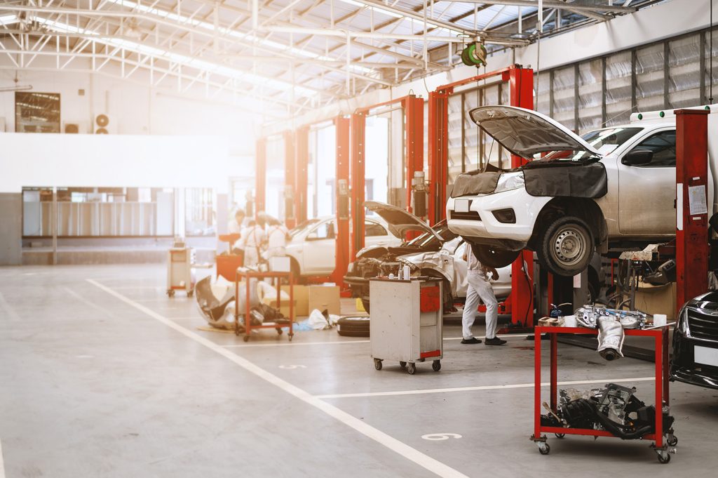 Auto mechanics in a car repair shop.