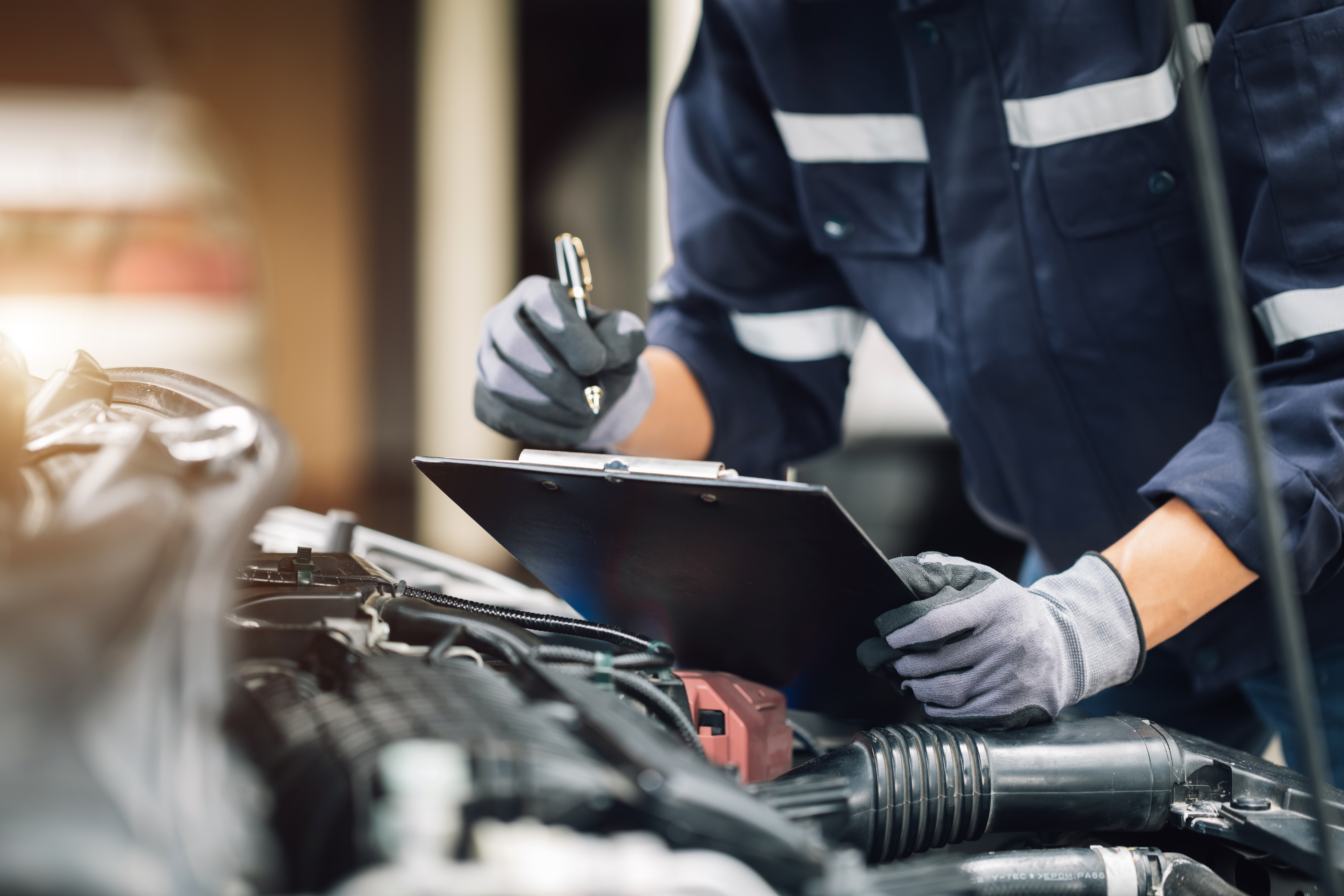 mechanic repairmen checking the system working engine